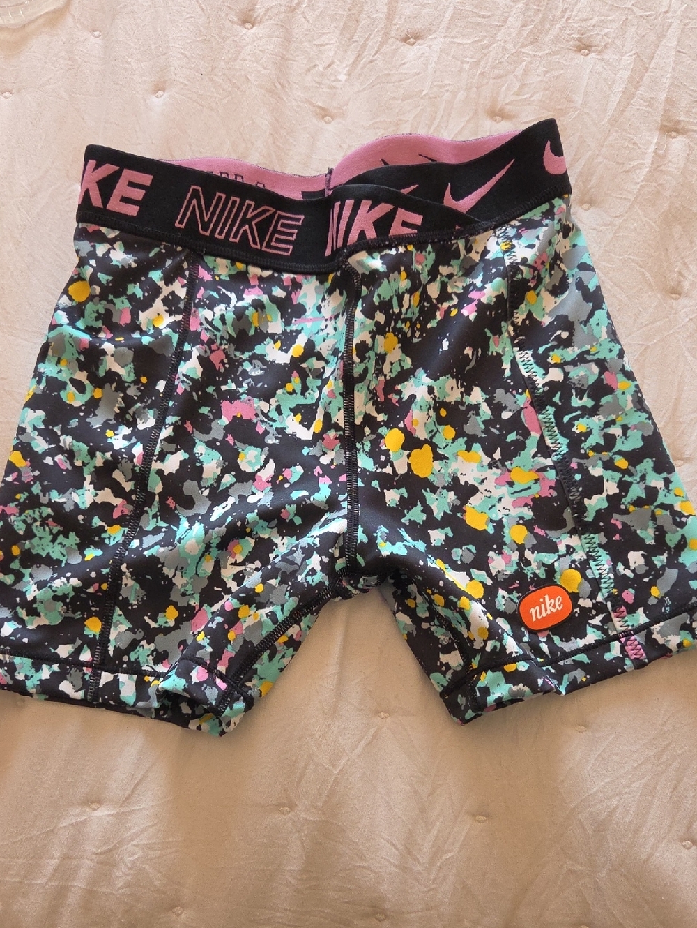 Nike Women's Multicolor Splatter Athletic Shorts - Black, Pink, Yellow, Teal